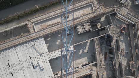 top view of a tower crane structure erected in a construction site