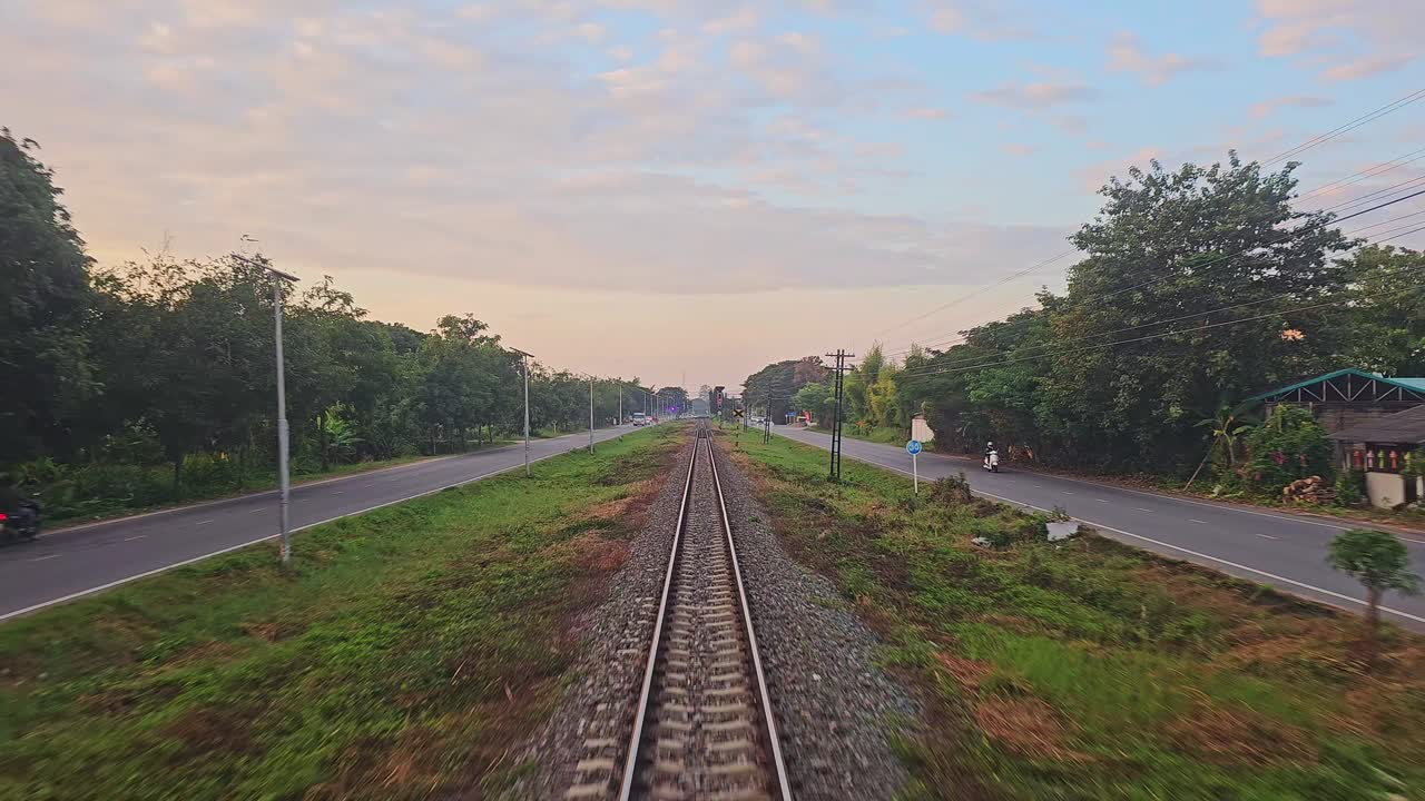 Train Tracks and Roads at Sunset