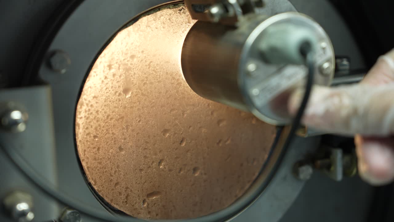 Technician Pressing The Button Of A Light To Inspect The Process Of An Industrial Machine During Procedure