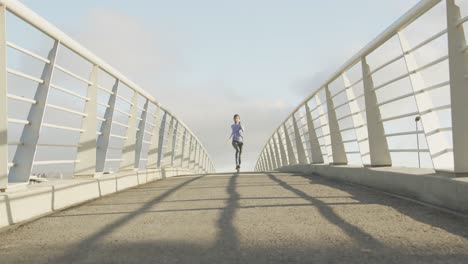 front view of woman wearing hijab running