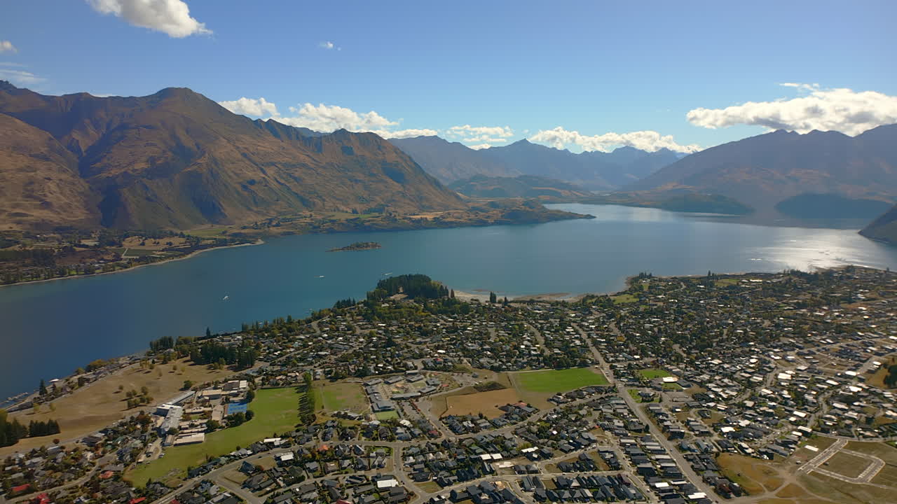 Wanaka township on the shore of Lake Wanaka, South Island, New Zealand - push in aerial