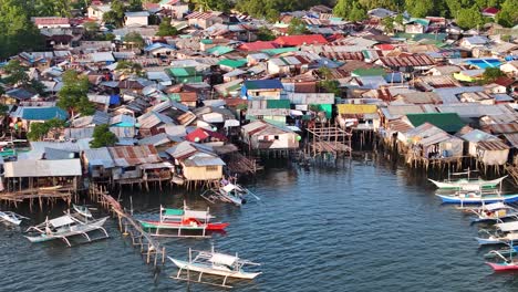 floating fishing village on water, aerial close up. poor development, coron, philippines.