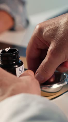 vertical video senior specialist preparing all the pills and supplements for the woman patient