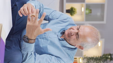 Vertical-video-of-The-old-man-who-is-hesitant-to-leave-his-wife.