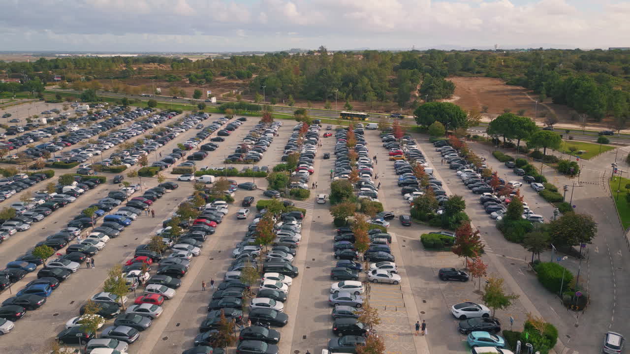 Drone view urban parking full of vehicles. Crowded city carpark at shopping mall