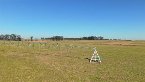 part side of irrigation wheelbase structure placed on expanded green field on a rural landscape