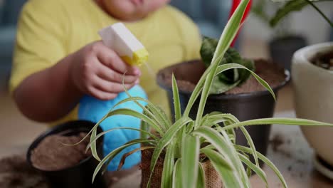 child watering plants