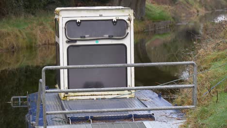 Waterways-Ireland---Rustic-Workboat-On-Grand-Canal-In-County-Kildare,-Ireland