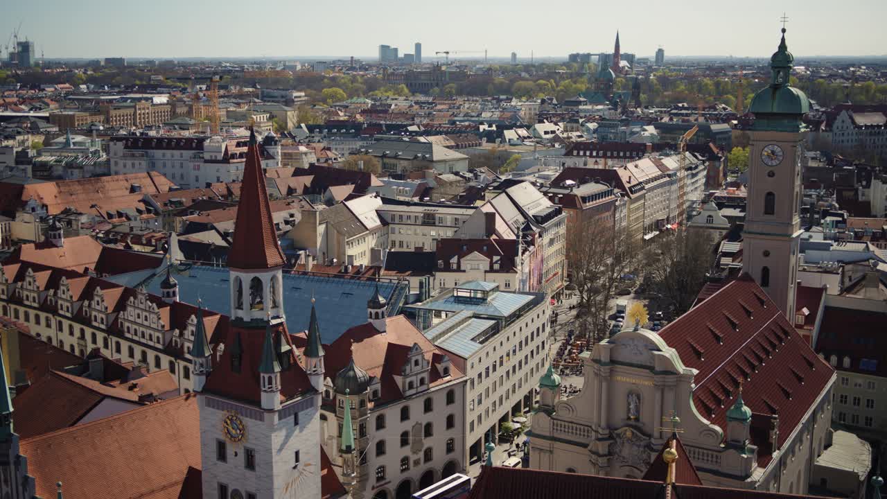 Historic city center of Munich facing east with the Tal street and Isartor in the distance, spring