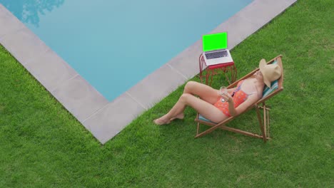 woman relaxing on chair in the backyard 4k