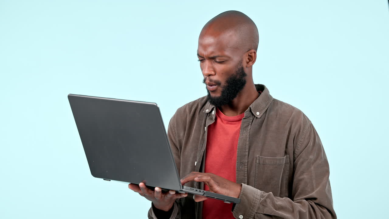 Laptop, black man and confused in studio for job