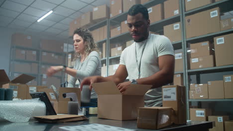 warehouse workers packing boxes