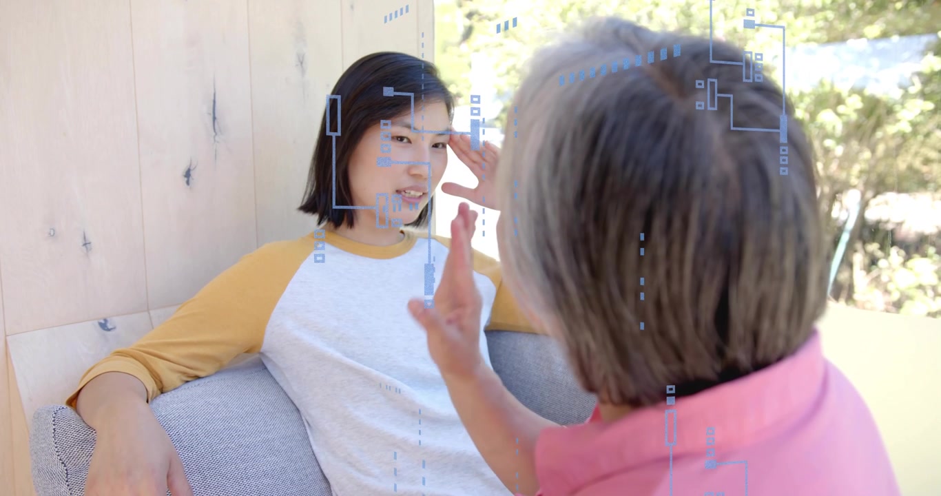 Woman leaning back raising hand to temple on couch, activating tech interface overlay on both faces