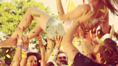 animation of confetti falling over friends throwing woman in the air