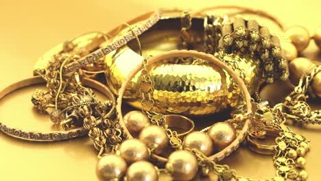 gold jewelry pile turning slowly