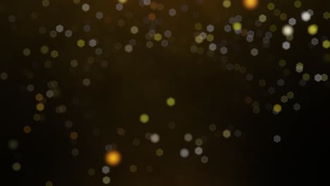 oro, partículas brillantes flotando hacia abajo en un fondo oscuro en animación en bucle de cámara lenta