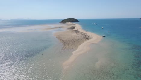 Boats-Anchored-In-The-Ocean-Near-Langford-Island-With-Sand-Spit---Whitsunday-Islands,-QLD,-Australia