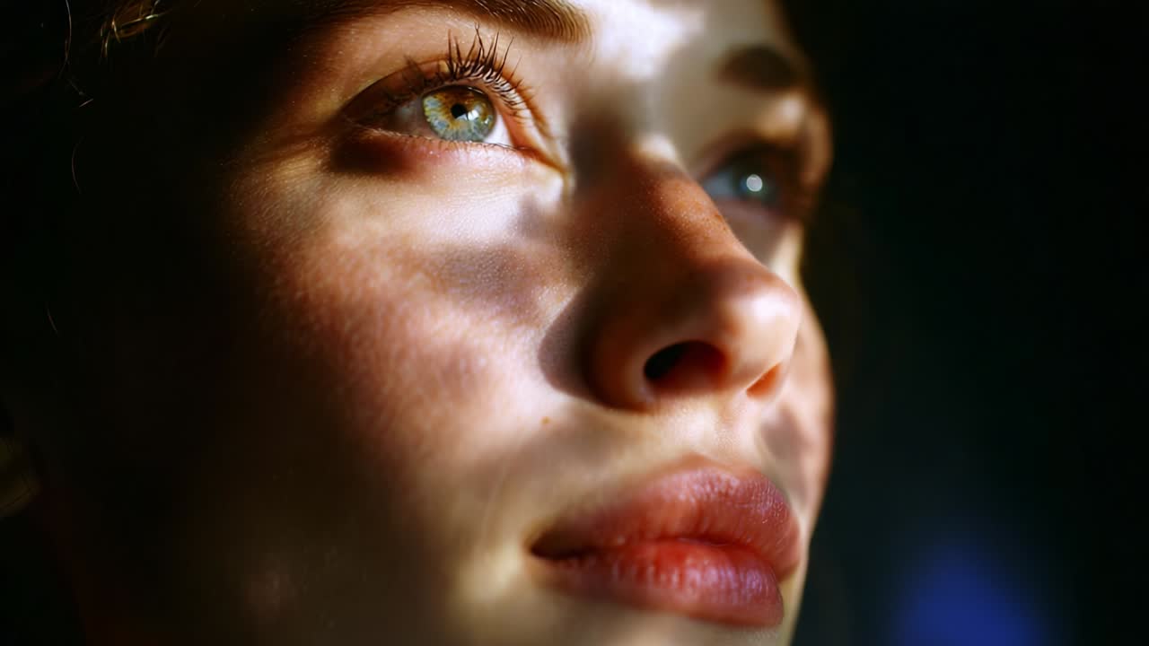 A Captivating Close-Up of a Young Woman's Face Illuminated by Natural Light, Showcasing Beautiful Features and Intricate Shadows Playing Across Her Skin, Invoking Emotion and Depth in Each Frame