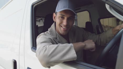 young male van driver with a warehouse delivery