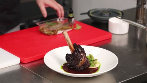 chef preparing gourmet braised lamb shanks