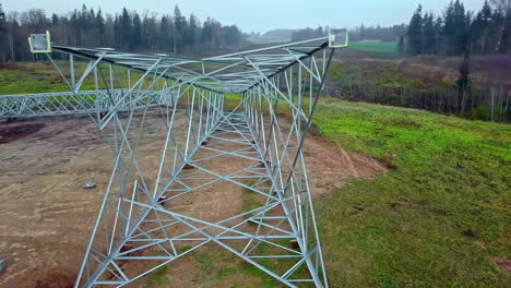 Tower-Body-And-Crossarm-Of-Power-Transmission-Tower-On-The-Ground-For-Installation