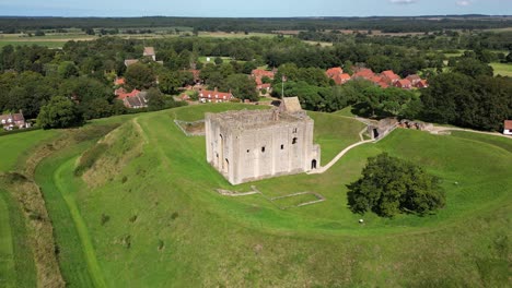 Aerial-approach-and-flyover-of-Castle-Rising,-Norfolk,-UK