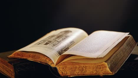open antique book with architectural illustration