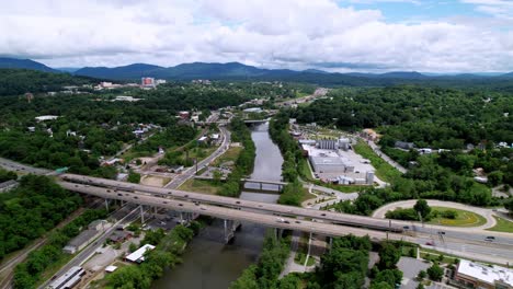 Aerial-push-down-French-Broad-River-in-Asheville-NC,-Asheville-North-Carolina