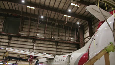 airplanes being constructed in a hangar