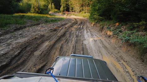 suv rides on an extremely bad dirt road a top view stabilized on 3 axes shot