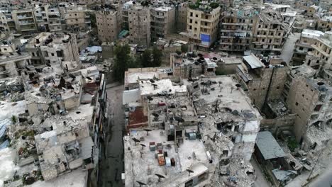 aerial view over a syrian city. some of the buildings are still in ruins after the civil war 10 years ago 4k