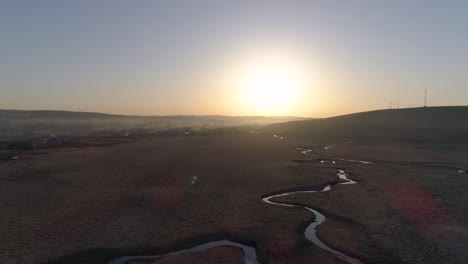 Flying-over-the-river-in-sun-rays