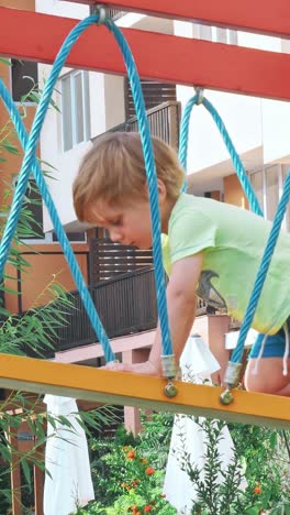 happy boy having fun in kids amusement park