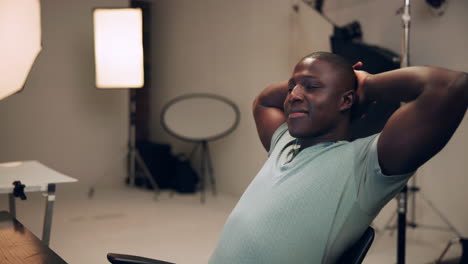 relaxed portrait of a man in a studio