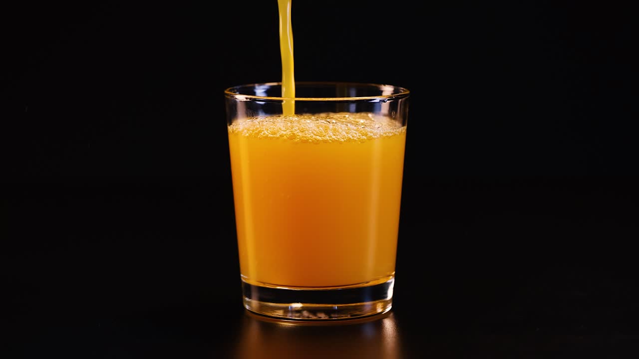 Juice being poured into a glass
