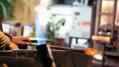 Glassblower-shaping-a-molten-glass