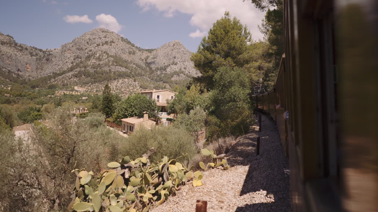 Old vintage wodden Soller Train in Mallorca driving along countryside