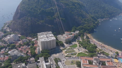 pan up of the cable cars going up to sugarloaf mountain in rio de janeiro