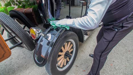 Chauffeur-Gently-Polishing-Wheel-Arch-Of-Vintage-Car