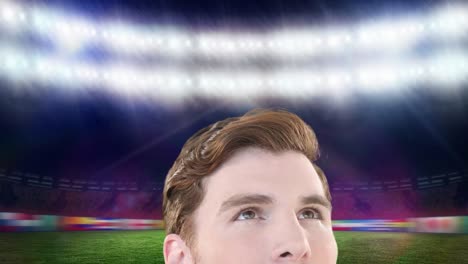 Animation-of-head-of-caucasian-man-looking-at-sports-stadium