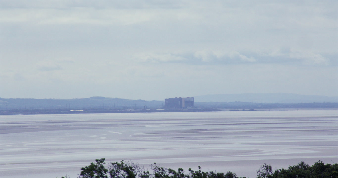 Long shot of Heysham Nuclear Power Station in Morecambe Bay at Circle, Birkrigg Stone Circle,