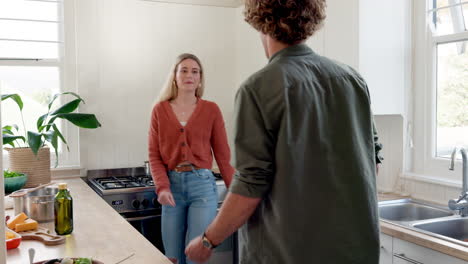 couple, dance and kiss in kitchen