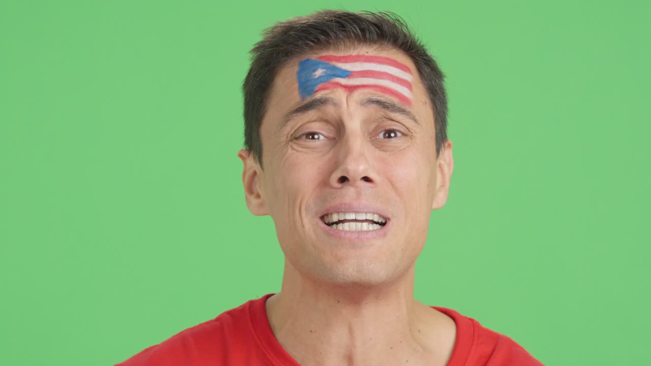 Very nervous man supporting puerto rican team during a difficult match