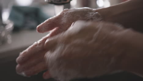 close up of woman thoroughly washing her hands