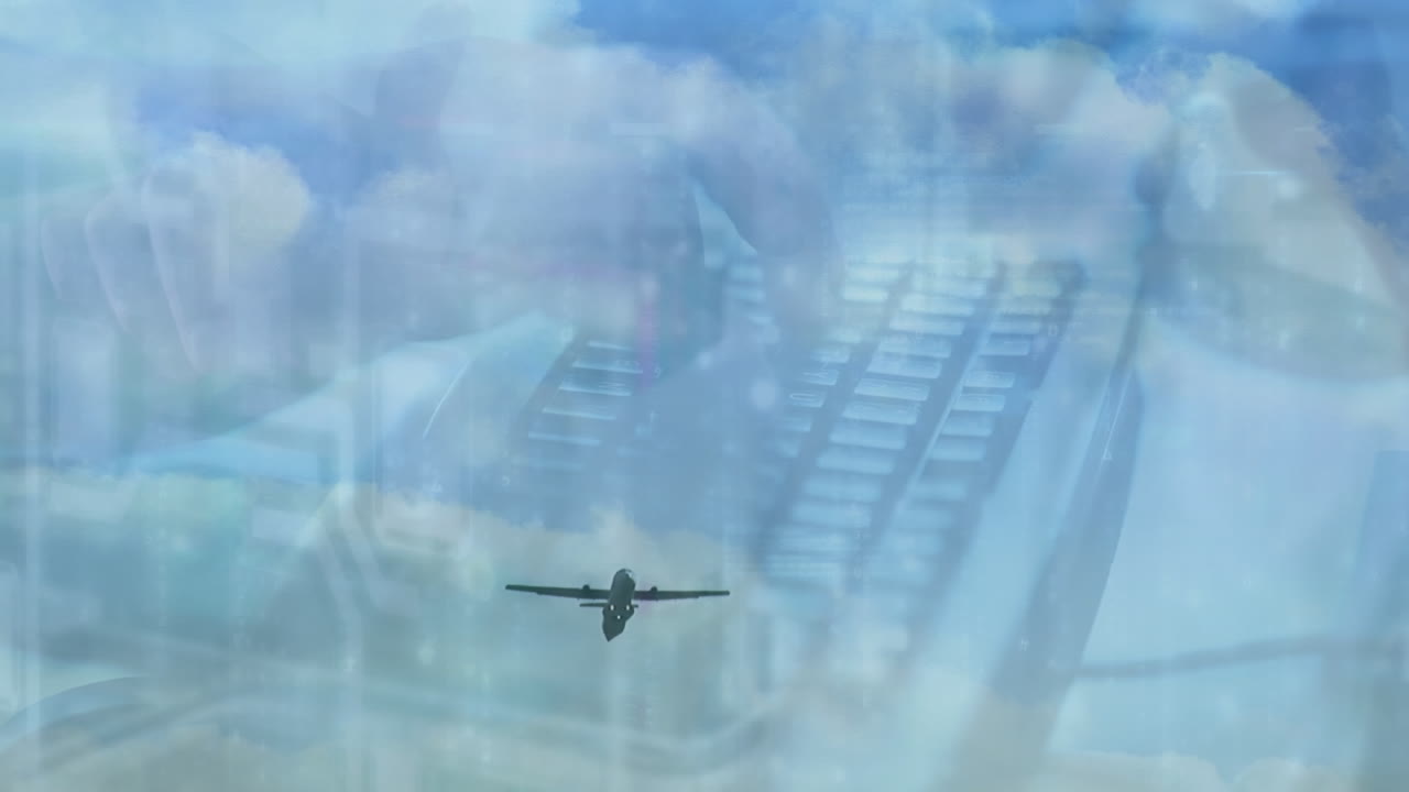 키보드에 타이핑하는 백인 남자의 손 위에 있는 하늘과 비행기의 애니메이션