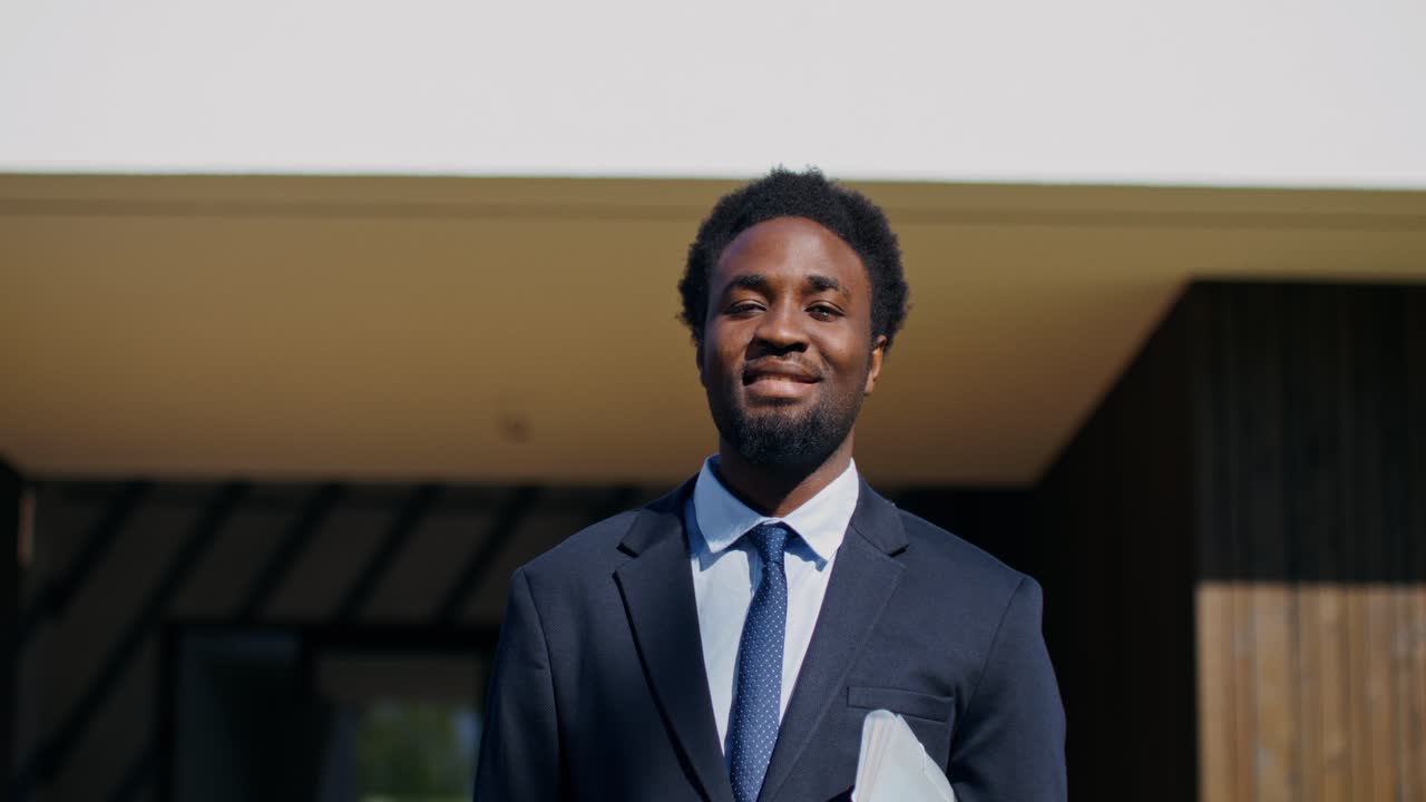 African American Business Professional in Front of Modern Home