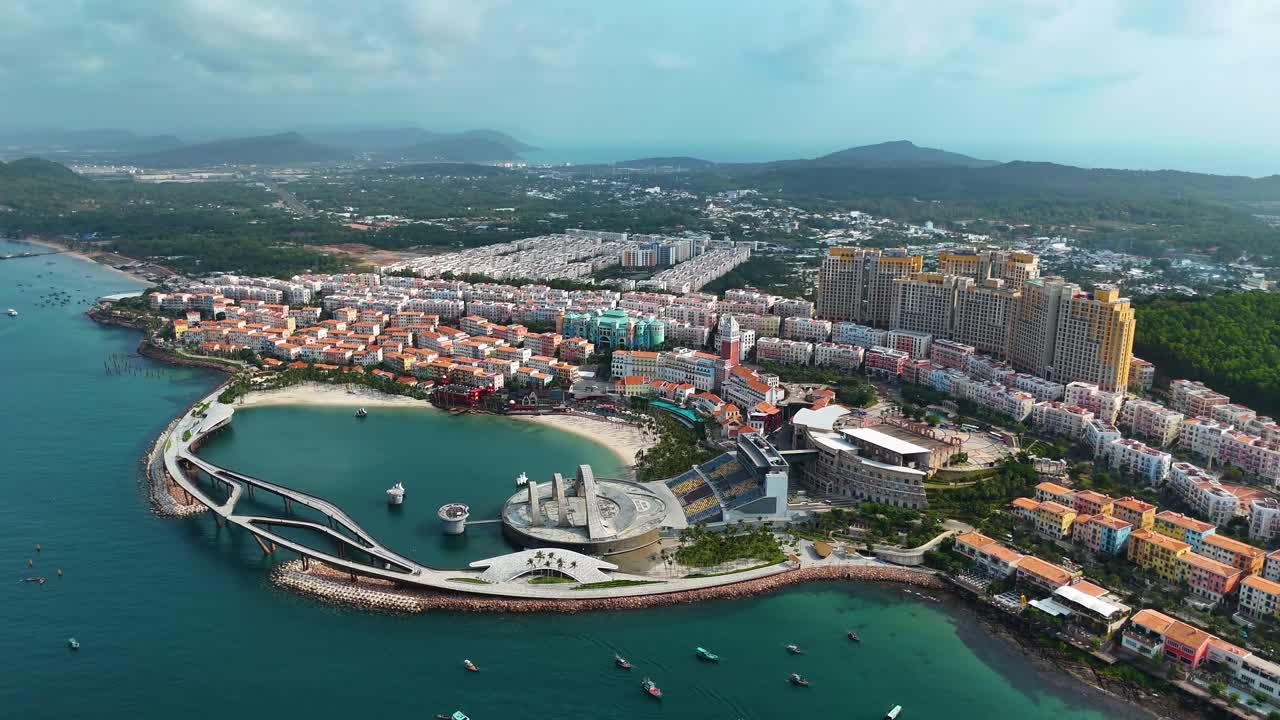 Aerial: Sunset Town panoramic view during the day, a fake Italian city in Phu Quoc Island, Vietnam, pull-out drone shot