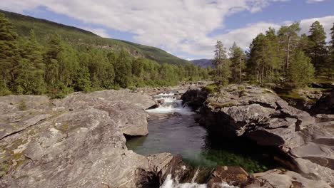 aerial of a small river with rapids and pools in northern norway