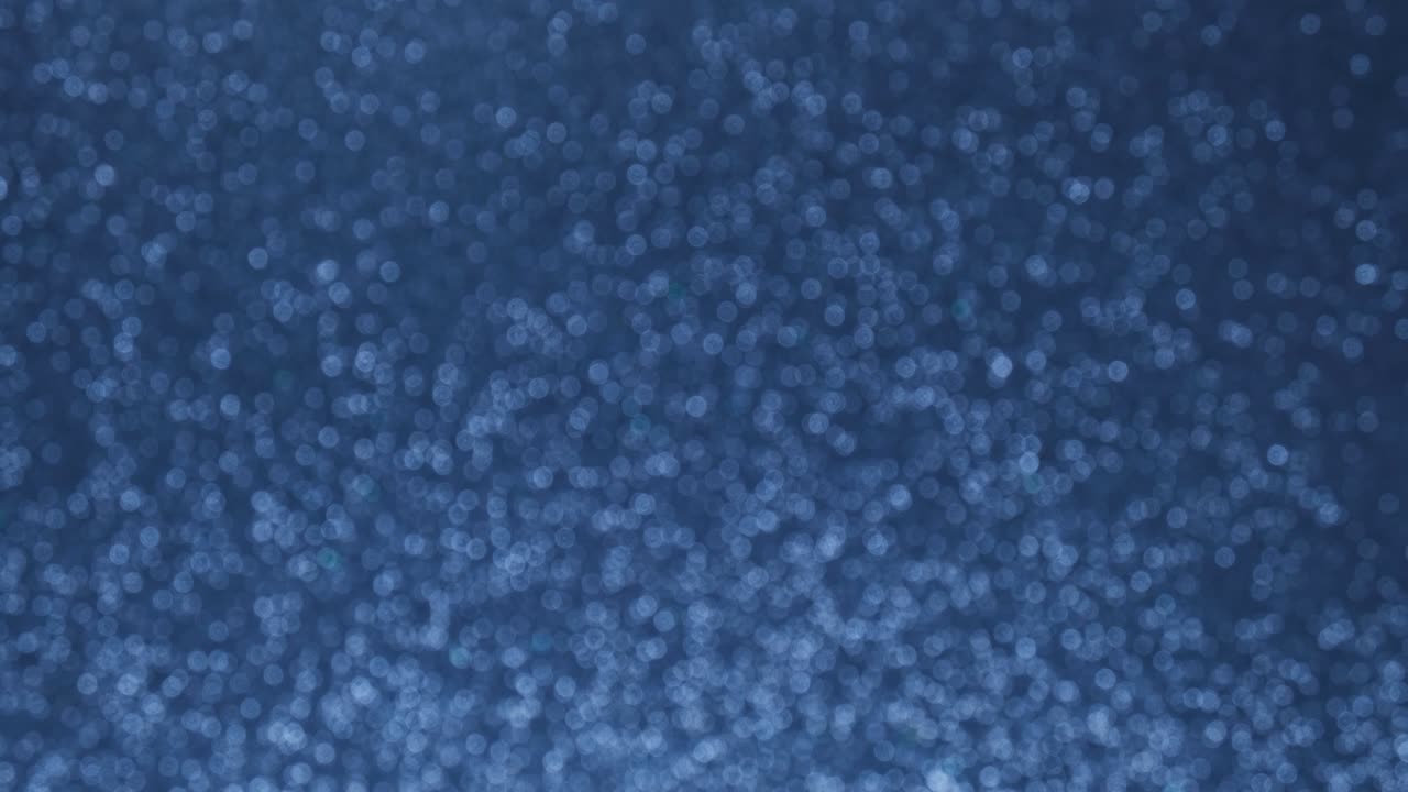 fondo de bokeh azul abstracto brillante. aumentar y disminuir suavemente el parpadeo de las luces azules. fondo de concepto de vacaciones