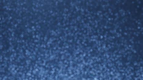 fondo de bokeh azul abstracto brillante. aumentar y disminuir suavemente el parpadeo de las luces azules. fondo de concepto de vacaciones